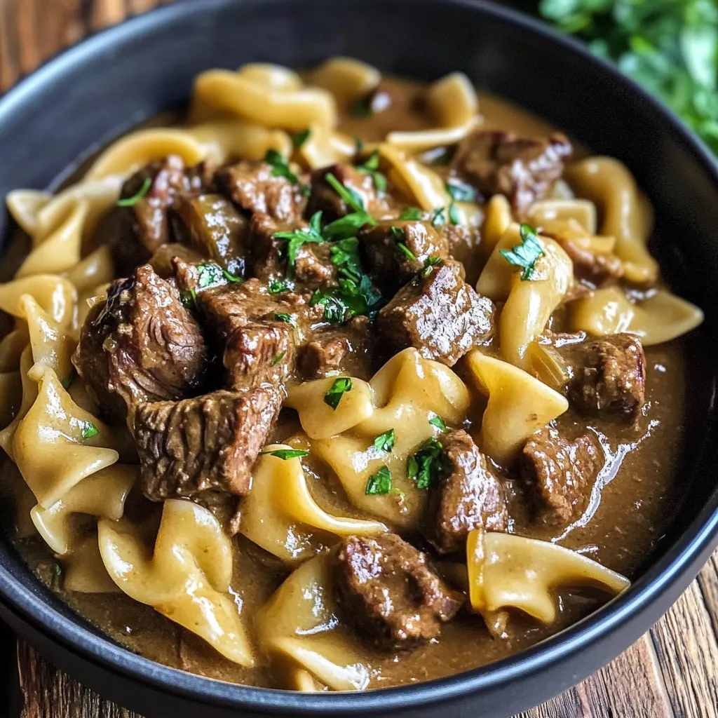 A bowl of pasta with meat sauce.