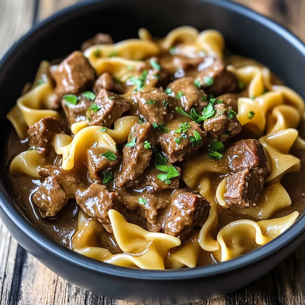 A bowl of meat and noodles.