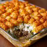 A pan of food with a close up of a piece of food.