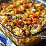 A casserole dish filled with meat and vegetables.