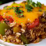 A plate of food with rice and meat.