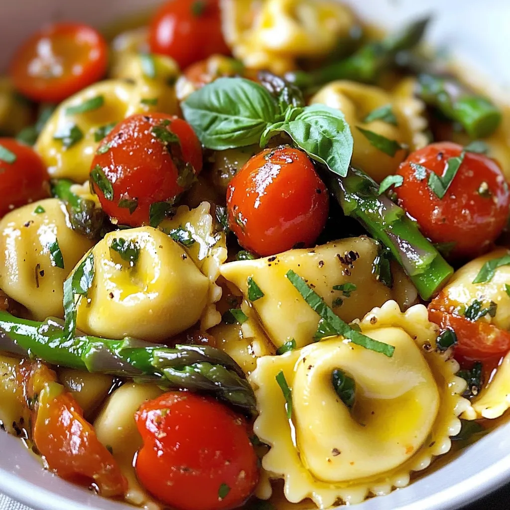 A bowl of pasta with tomatoes and asparagus.