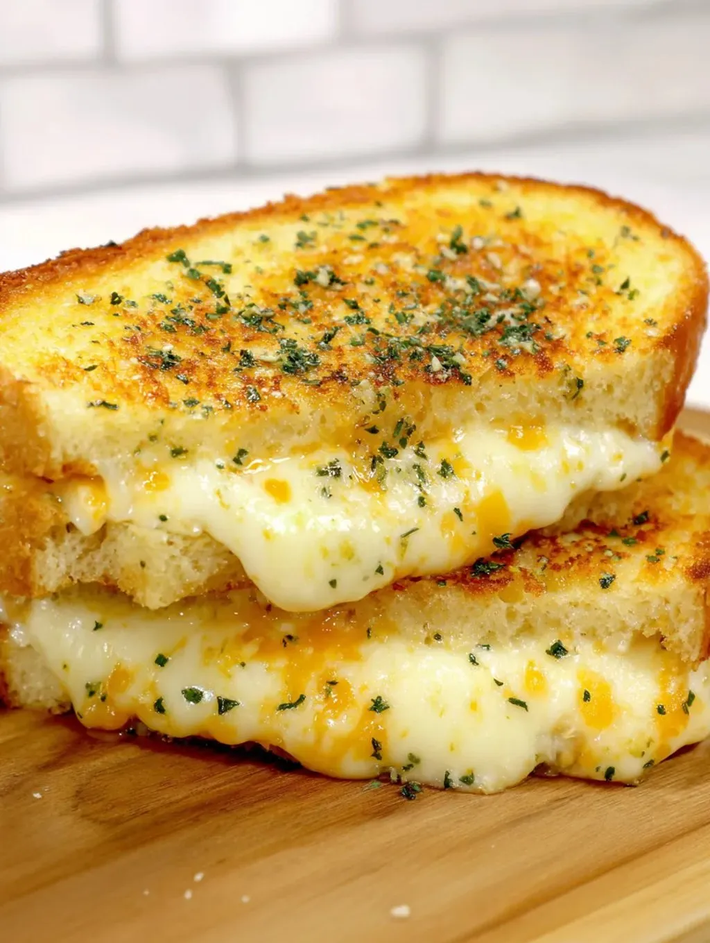 Two pieces of cheese and herb toast.