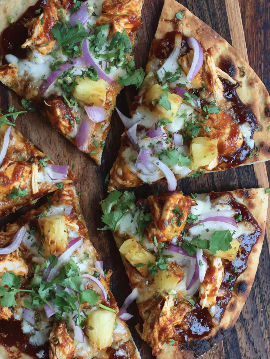 A pizza with pineapple and onions on top.