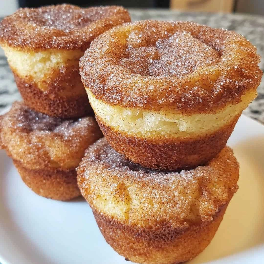 Three stacks of cinnamon sugar French toast muffins.