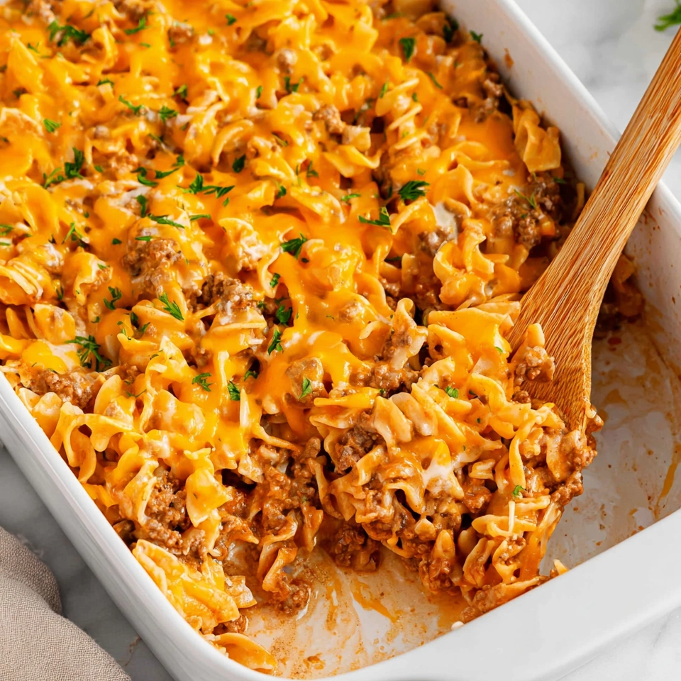 A beef noodle casserole in a white dish.