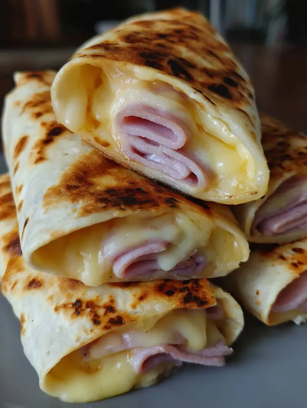 A stack of air fryer hot chicken wraps.