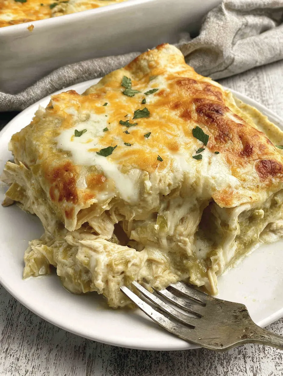 A plate of green chile chicken enchiladas.