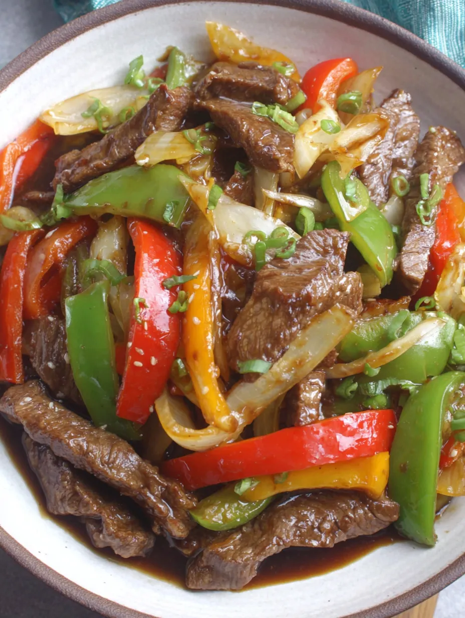 A bowl of Chinese pepper steak stir-fry.