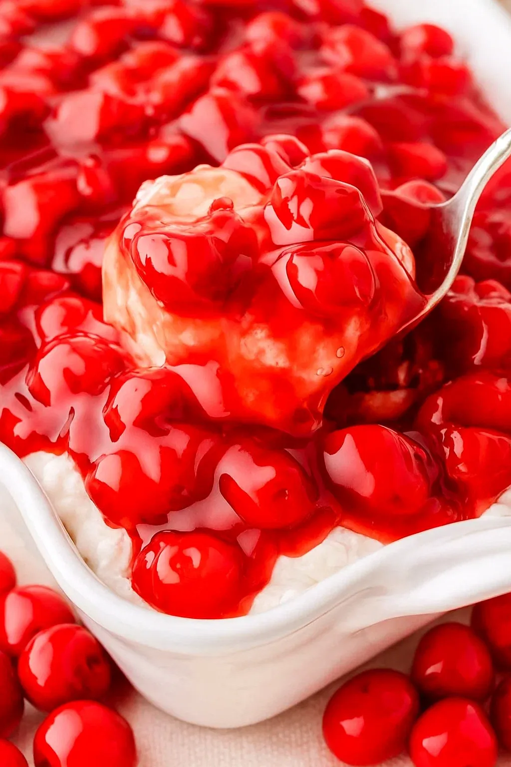 A bowl of cherries in the snow.