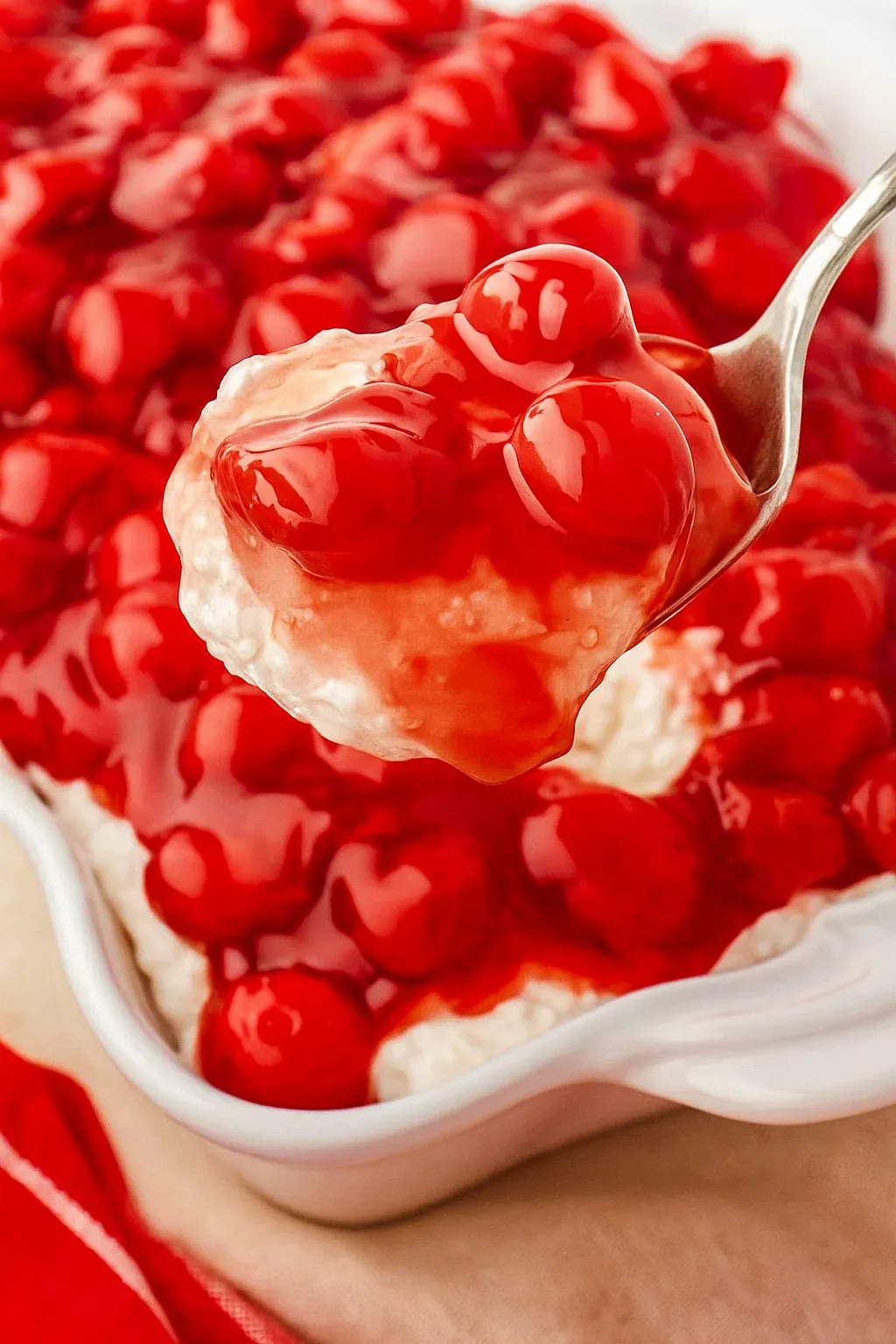 A spoonful of cherries in the snow.