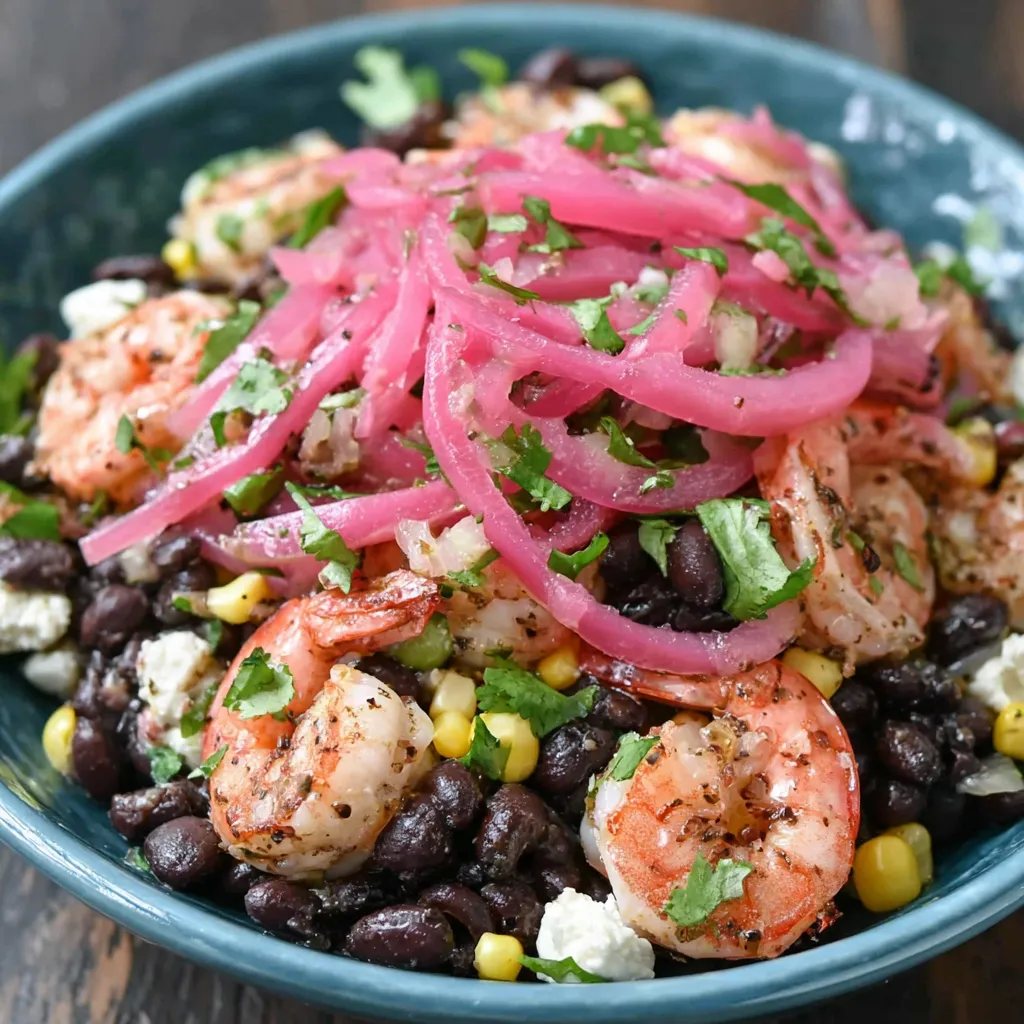 A bowl of black bean shrimp salad.