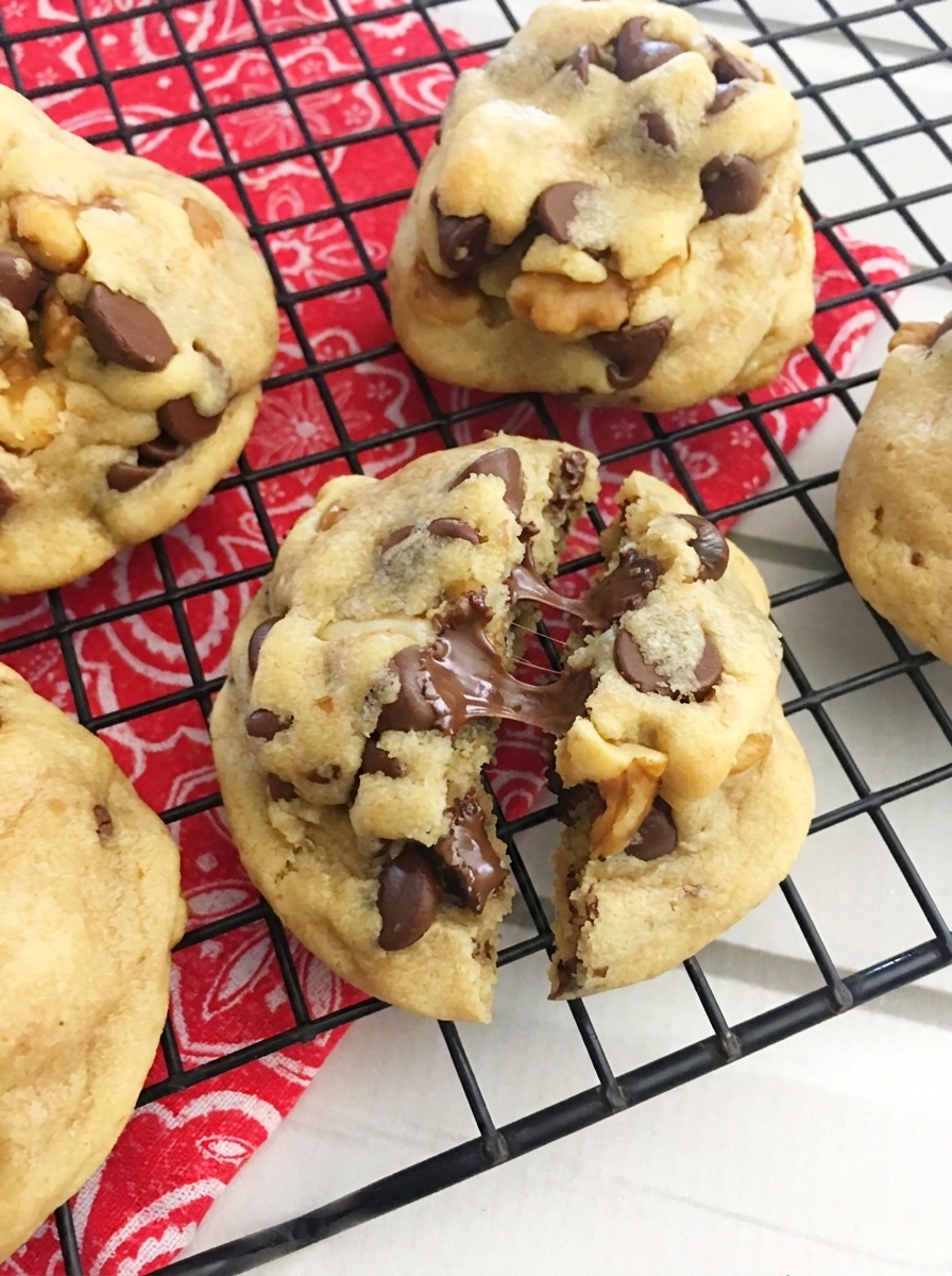 A tray of cookies with chocolate drizzle.