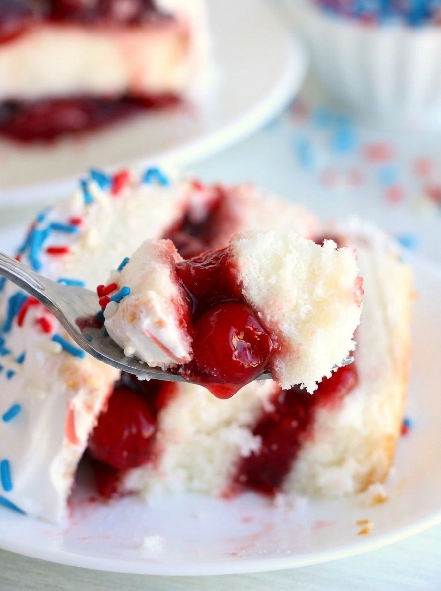 A fork is being used to eat a piece of cake.