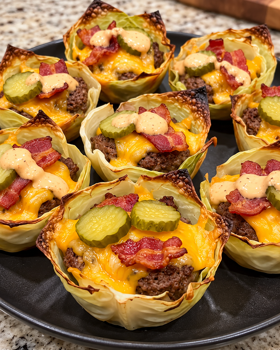 A plate of crispy bacon cheeseburger cabbage cups.